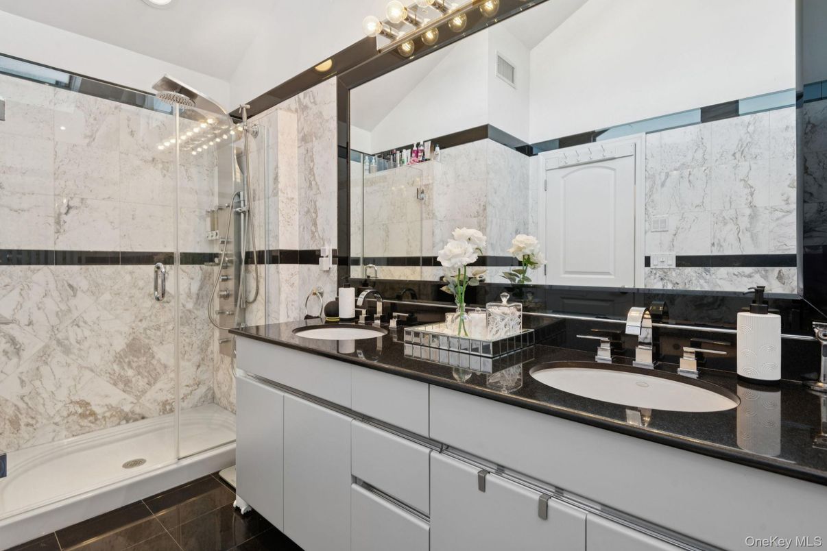 Bathroom, Dual Sink Vanities, Glass Shower, Interior, Marble Walls, Recessed Lighting
