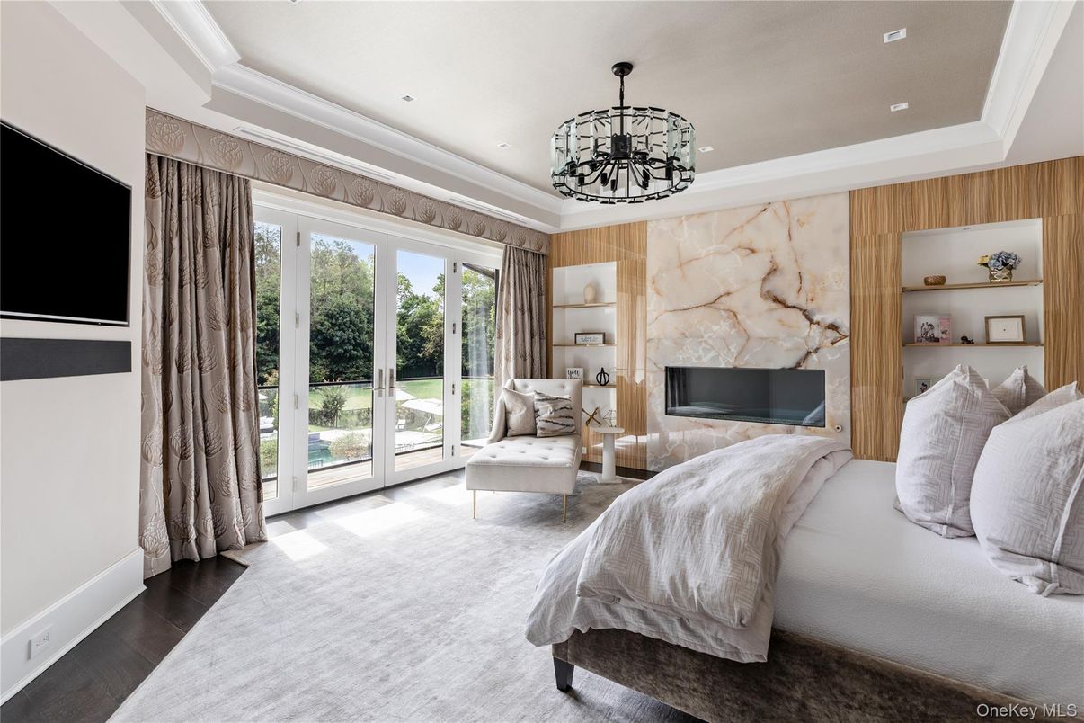 Bedroom, Chandelier, Fireplace, Interior, Recessed Lighting, Wood Texture Flooring