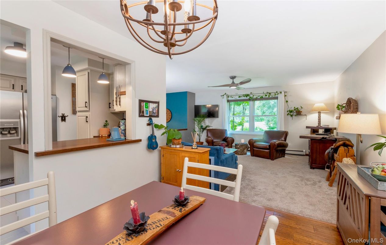 Chandelier, Dining room, Interior, Kitchen, Living room, Stainless Steel Appliances, Wood Texture Flooring