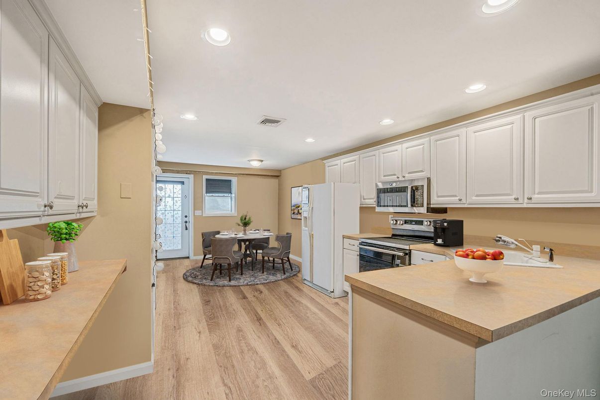Dining room, Interior, Kitchen, Recessed Lighting, Stainless Steel Appliances, Wood Texture Flooring