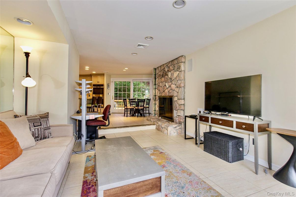 Dining room, Fireplace, Interior, Living room, Recessed Lighting, Stone Walls