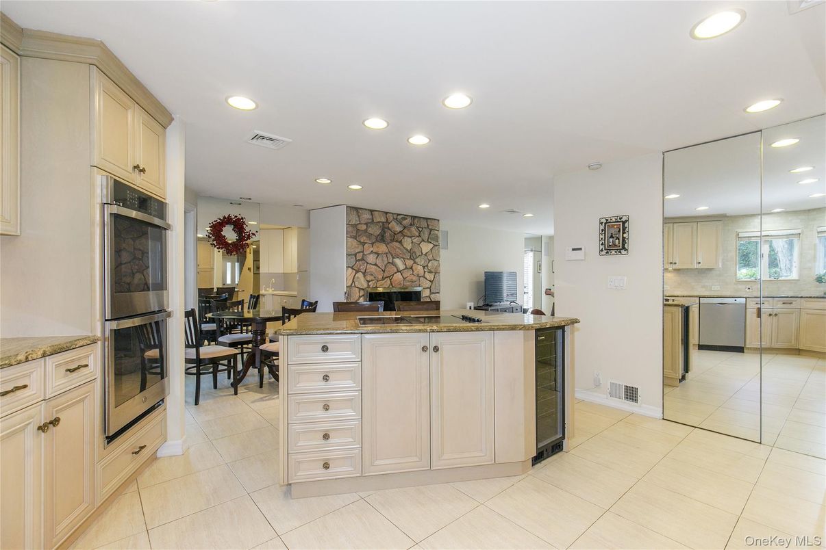Dining room, Fireplace, Interior, Kitchen, Recessed Lighting, Stainless Steel Appliances, Stone Walls