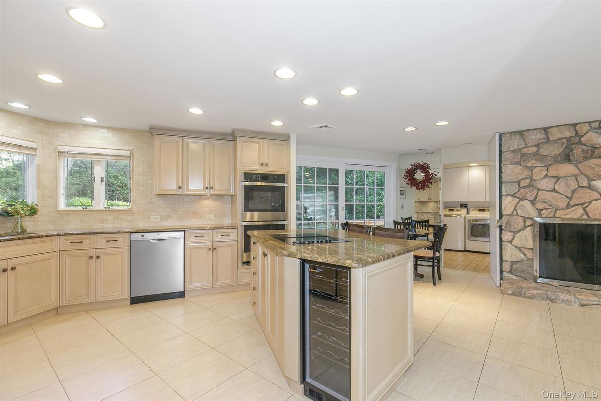 Fireplace, Interior, Kitchen, Recessed Lighting, Stainless Steel Appliances, Stone Walls