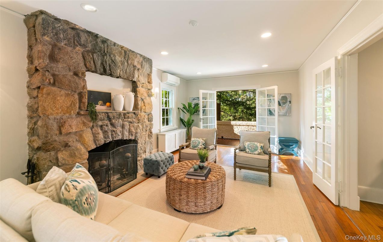 Fireplace, Interior, Living room, Recessed Lighting, Stone Walls, Wood Texture Flooring