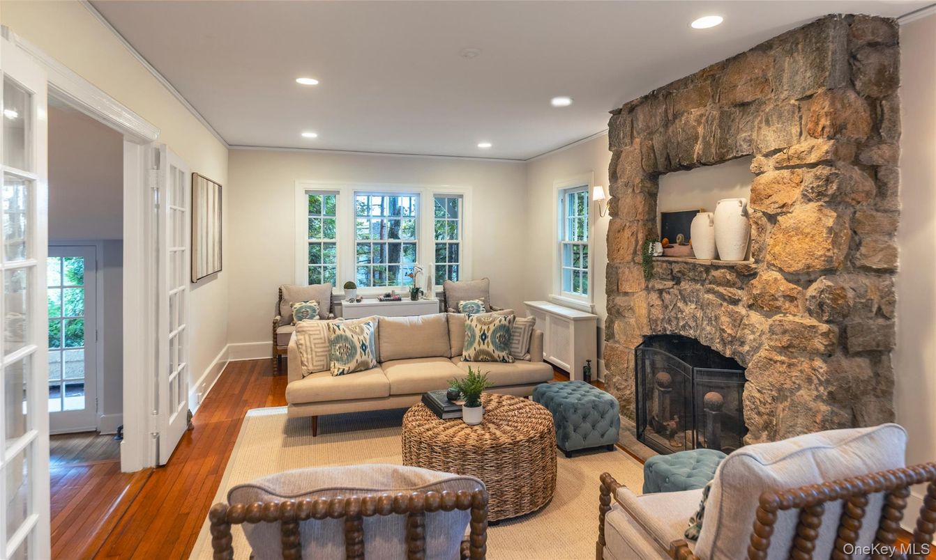 Fireplace, Interior, Living room, Recessed Lighting, Stone Walls, Wood Texture Flooring