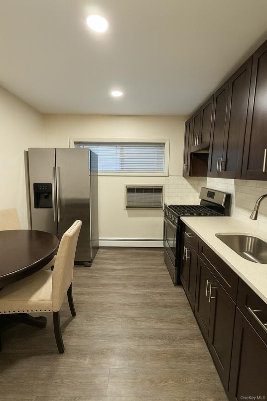 Dining room, Interior, Kitchen, Recessed Lighting, Stainless Steel Appliances, Wood Texture Flooring