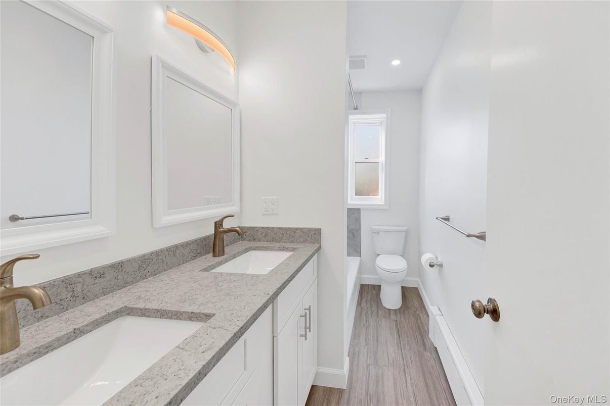 Bathroom, Dual Sink Vanities, Interior, Recessed Lighting, Wood Texture Flooring