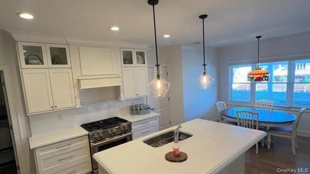 Dining room, Interior, Kitchen, Pendant Lights, Recessed Lighting, Stainless Steel Appliances, Water, Wood Texture Flooring