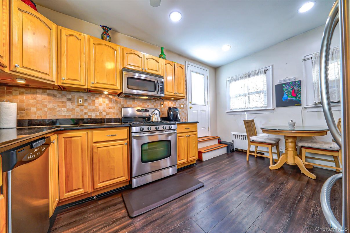 Dining room, Interior, Kitchen, Recessed Lighting, Stainless Steel Appliances, Wood Texture Flooring