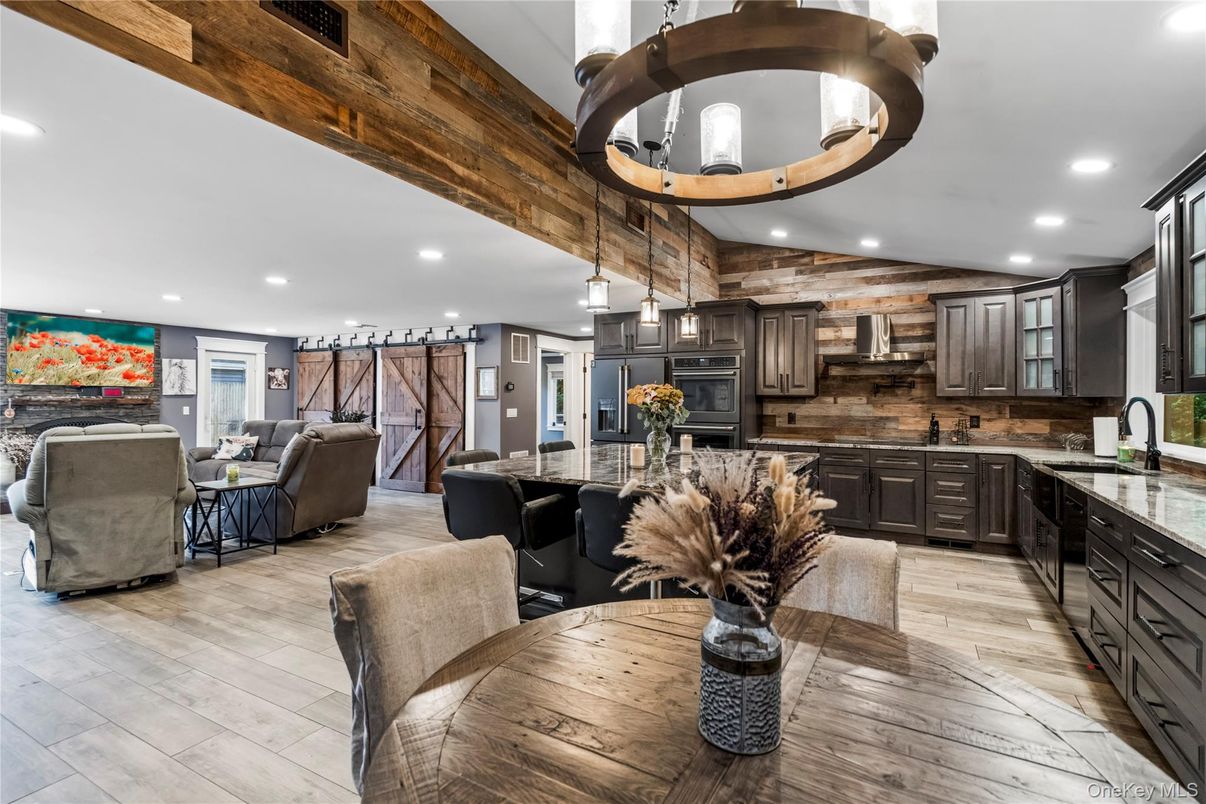 Interior, Kitchen, Living room, Pendant Lights, Recessed Lighting, Stainless Steel Appliances, Wood Texture Flooring, Wooden Walls