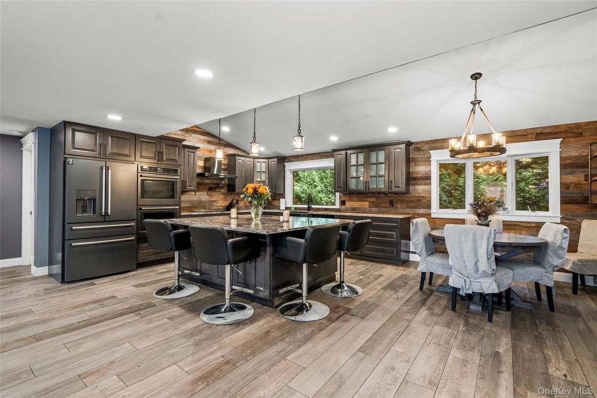 Dining room, Interior, Kitchen, Pendant Lights, Recessed Lighting, Stainless Steel Appliances, Wood Texture Flooring