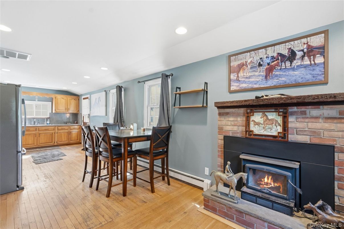 Dining room, Fireplace, Interior, Kitchen, Recessed Lighting, Stone Walls, Wood Texture Flooring