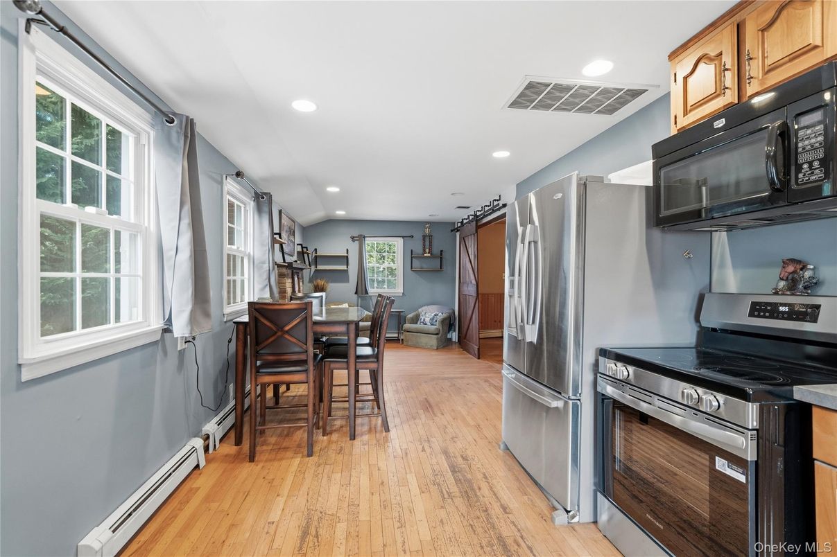 Dining room, Interior, Kitchen, Recessed Lighting, Stainless Steel Appliances, Wood Texture Flooring