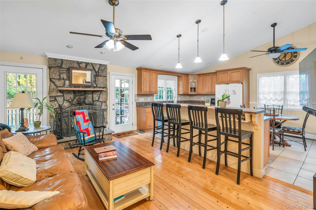 Dining room, Fireplace, Interior, Kitchen, Living room, Pendant Lights, Stone Walls, Wood Texture Flooring