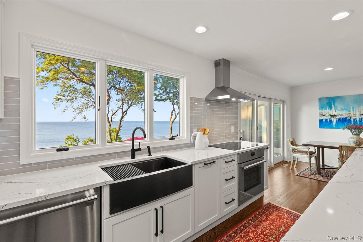 Dining room, Interior, Kitchen, Recessed Lighting, Stainless Steel Appliances, Water, Wood Texture Flooring