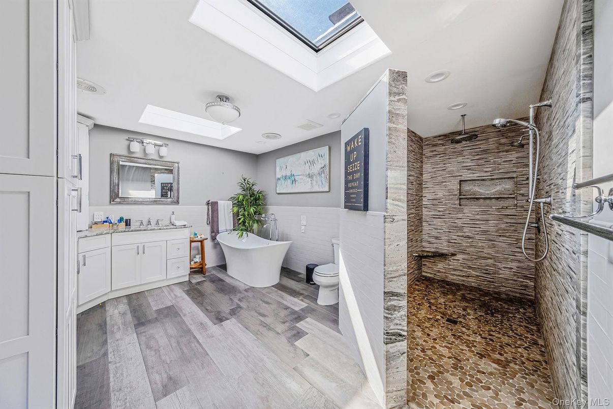 Bathroom, Dual Sink Vanities, Free Standing Baths, Interior, Recessed Lighting, Wood Texture Flooring