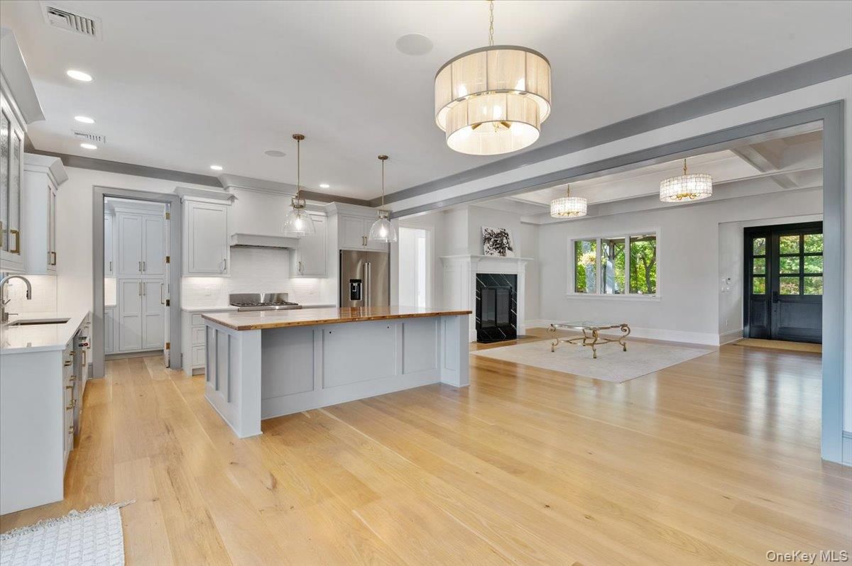 Chandelier, Fireplace, Interior, Kitchen, Pendant Lights, Recessed Lighting, Wood Texture Flooring