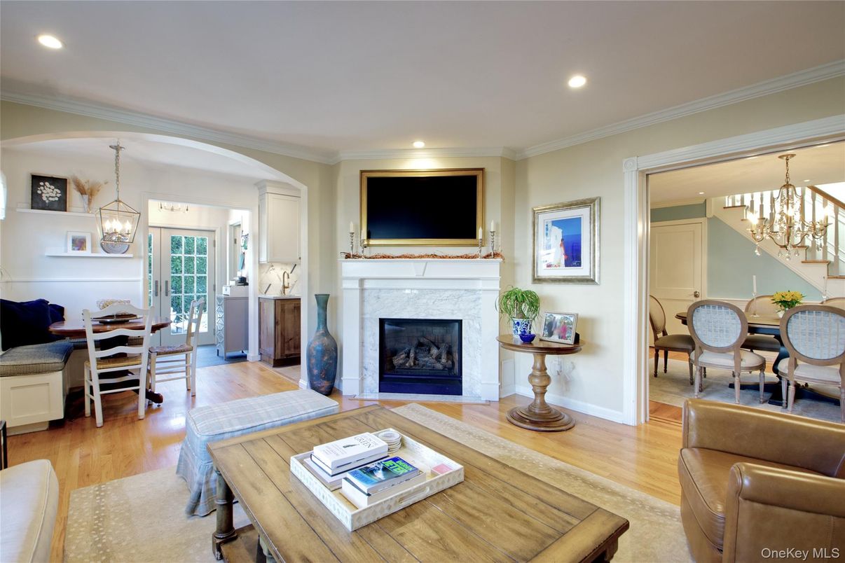 Chandelier, Dining room, Fireplace, Interior, Living room, Pendant Lights, Recessed Lighting, Wood Texture Flooring