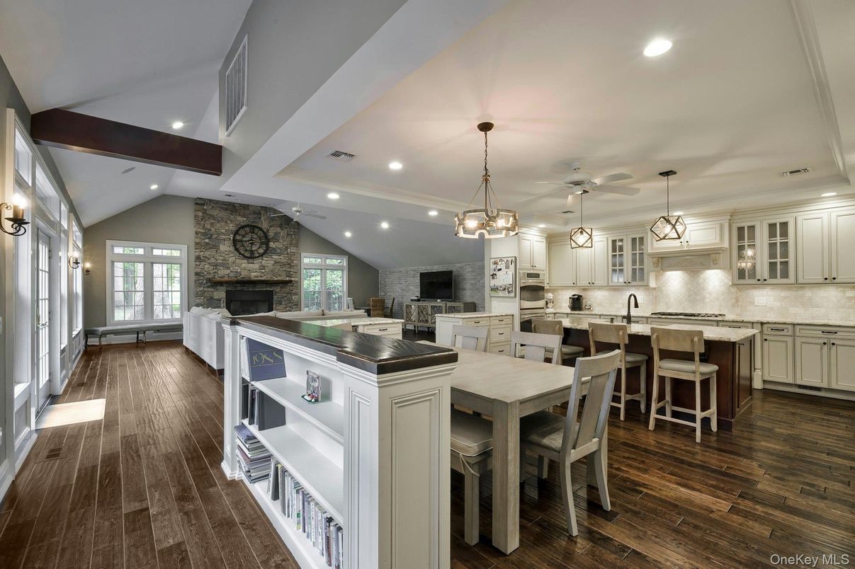 Fireplace, Interior, Kitchen, Pendant Lights, Recessed Lighting, Stainless Steel Appliances, Stone Walls, Wooden Beams, Wood Texture Flooring