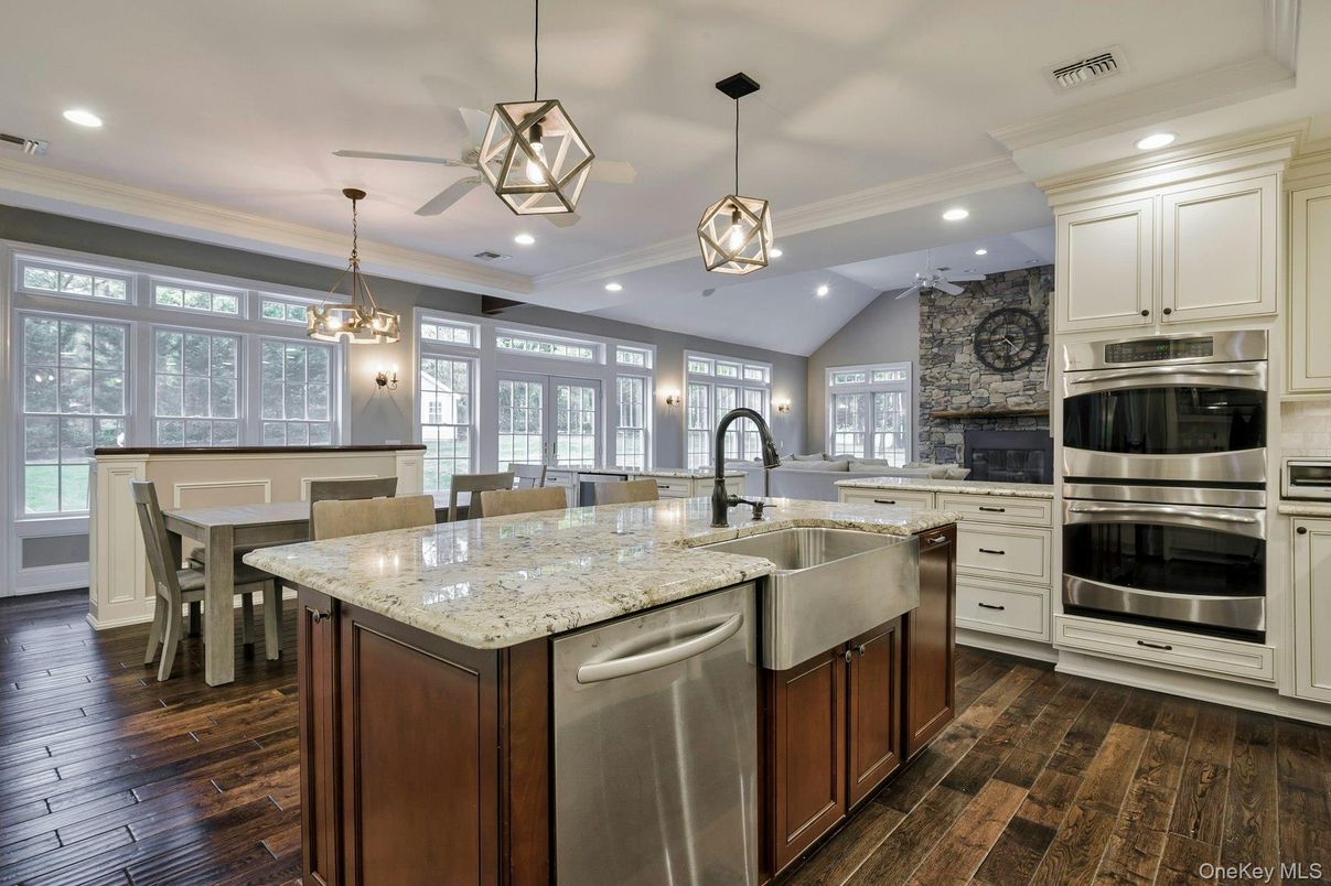 Dining room, Interior, Kitchen, Pendant Lights, Recessed Lighting, Stainless Steel Appliances, Stone Walls, Wood Texture Flooring