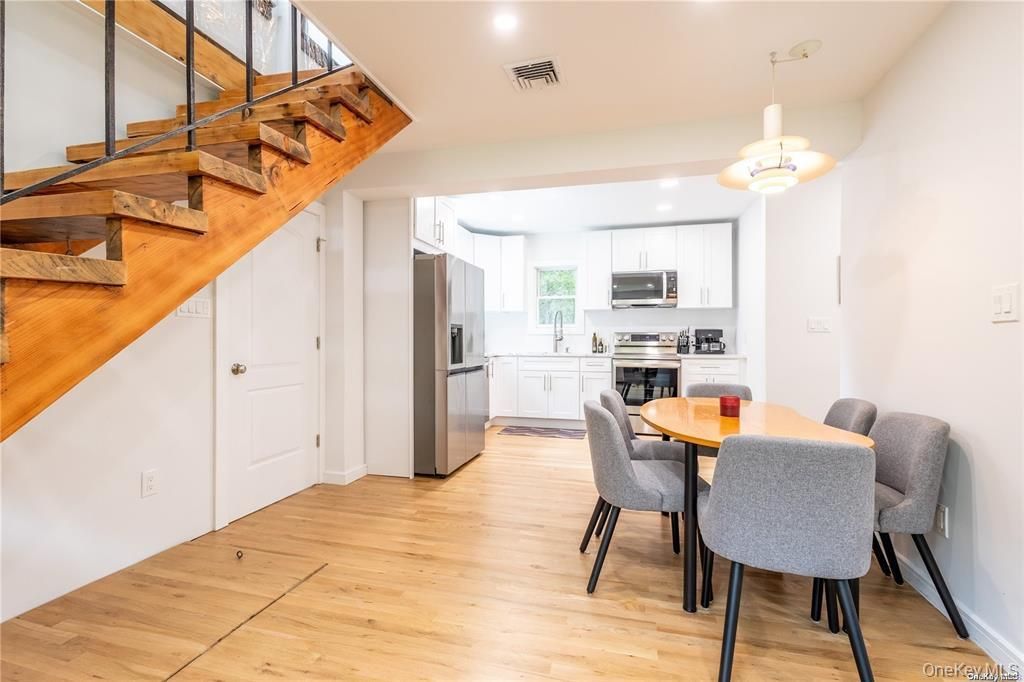 Dining room, Interior, Kitchen, Pendant Lights, Recessed Lighting, Stainless Steel Appliances, Wood Texture Flooring