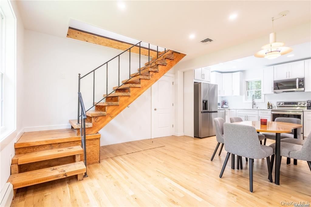 Dining room, Interior, Kitchen, Pendant Lights, Recessed Lighting, Stainless Steel Appliances, Wood Texture Flooring