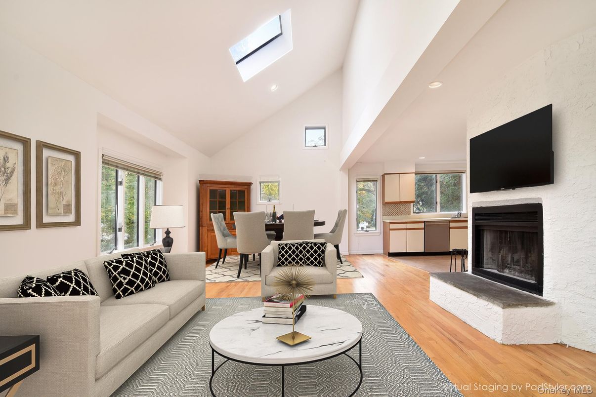 Dining room, Fireplace, Interior, Living room, Recessed Lighting, Wood Texture Flooring