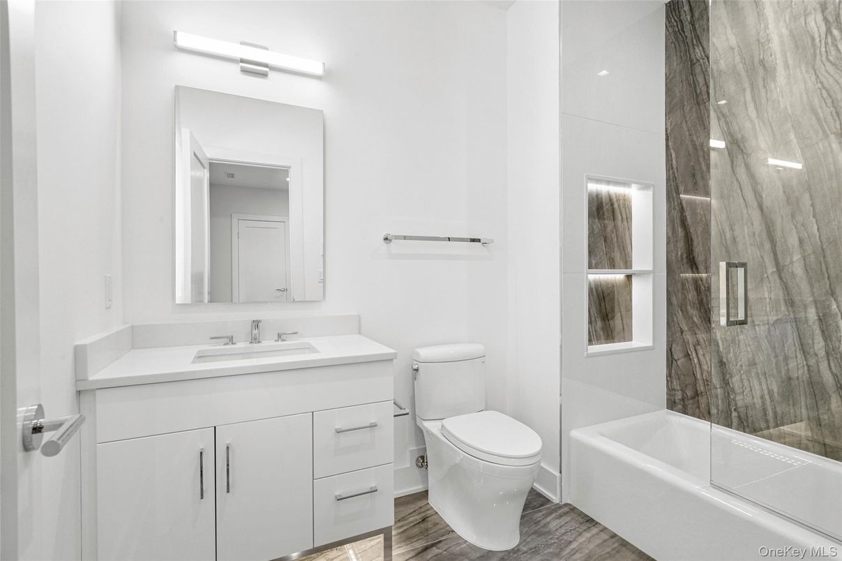 Bathroom, Glass Shower, Interior, Marble Walls, Wood Texture Flooring