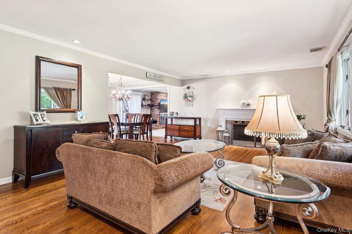 Chandelier, Dining room, Fireplace, Interior, Living room, Recessed Lighting, Wood Texture Flooring