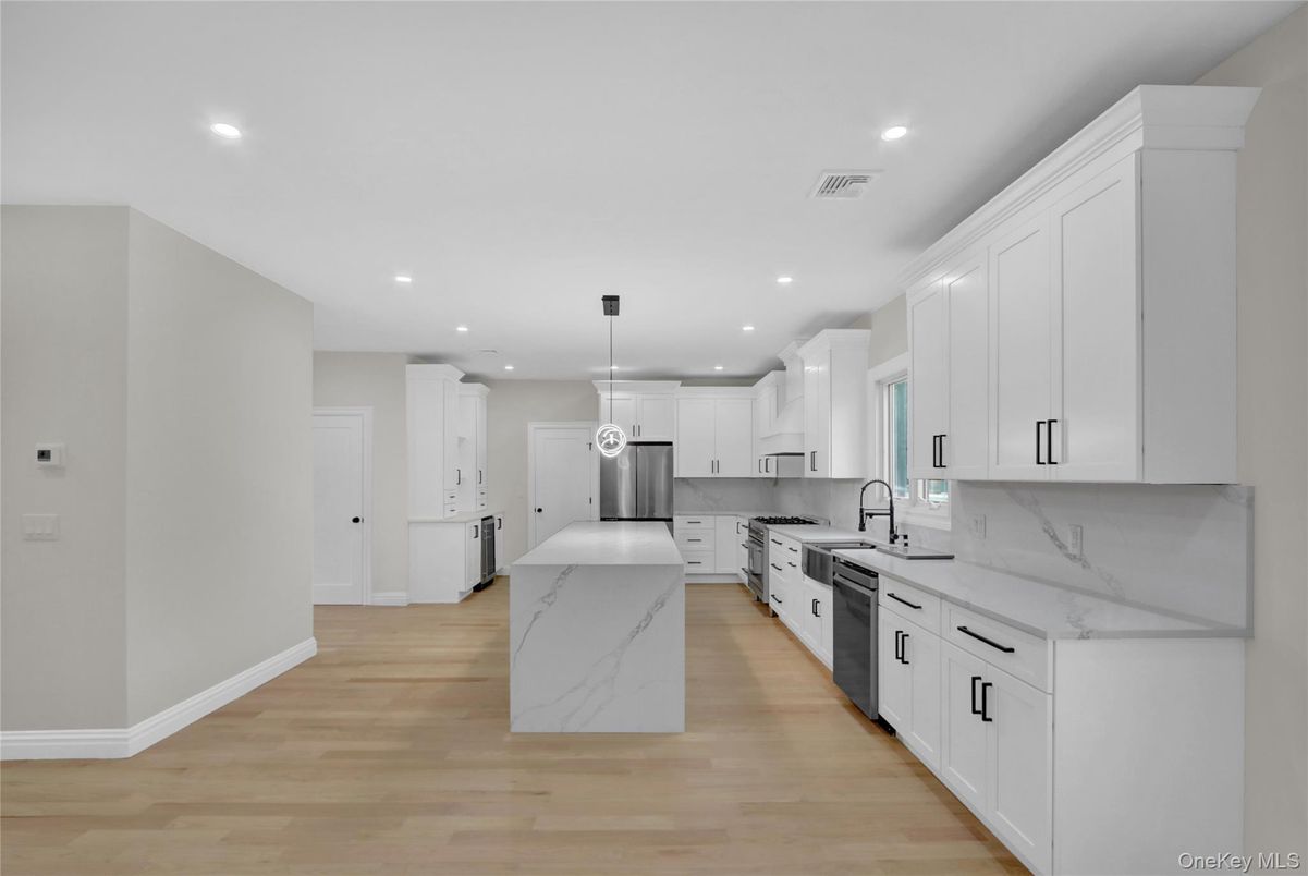 Interior, Kitchen, Marble Walls, Pendant Lights, Recessed Lighting, Stainless Steel Appliances, Wood Texture Flooring