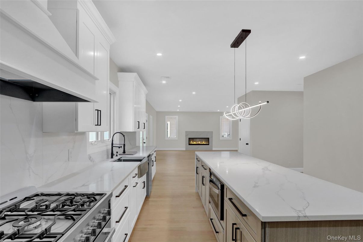 Fireplace, Interior, Kitchen, Pendant Lights, Recessed Lighting, Stainless Steel Appliances, Wood Texture Flooring