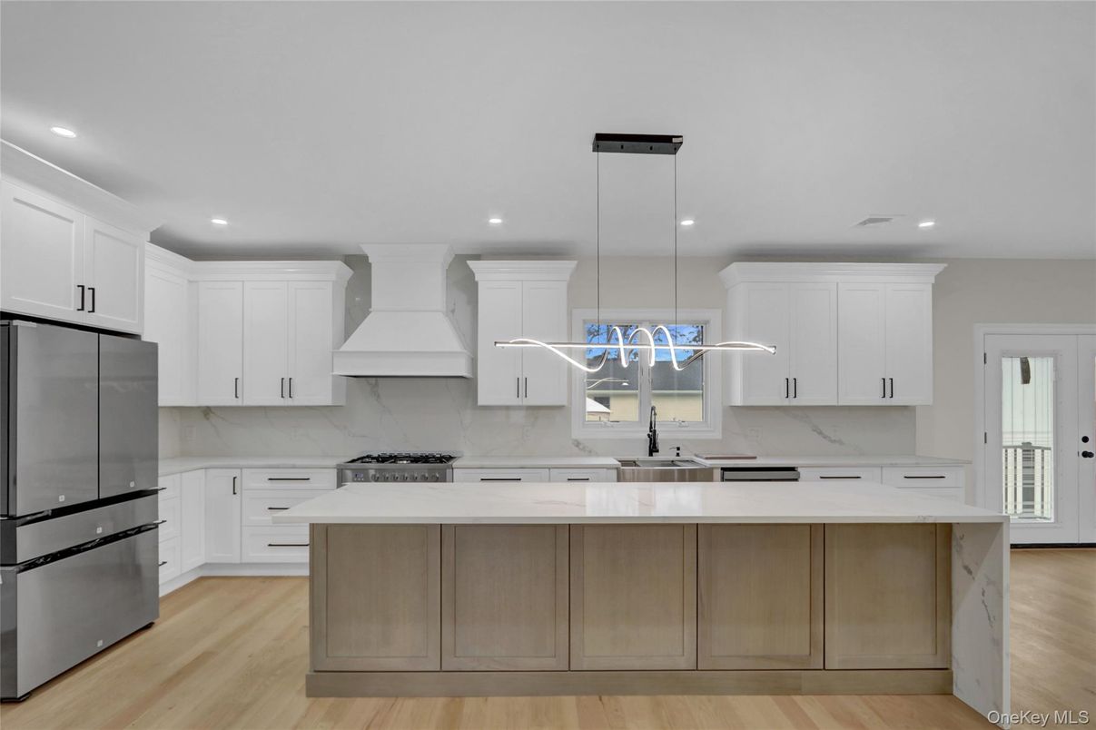 Interior, Kitchen, Marble Walls, Pendant Lights, Recessed Lighting, Stainless Steel Appliances, Wood Texture Flooring