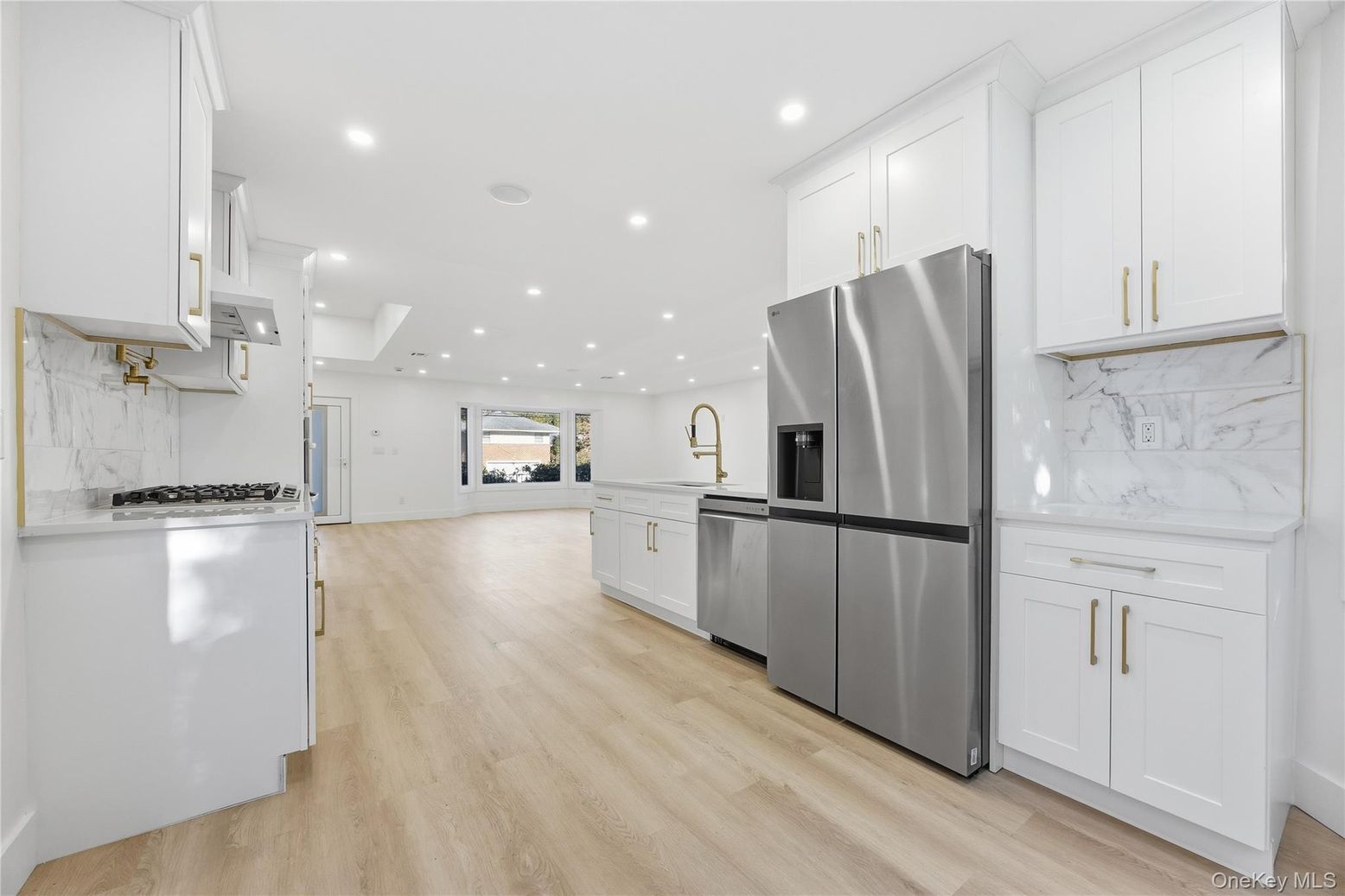 Interior, Kitchen, Marble Walls, Recessed Lighting, Stainless Steel Appliances, Wood Texture Flooring