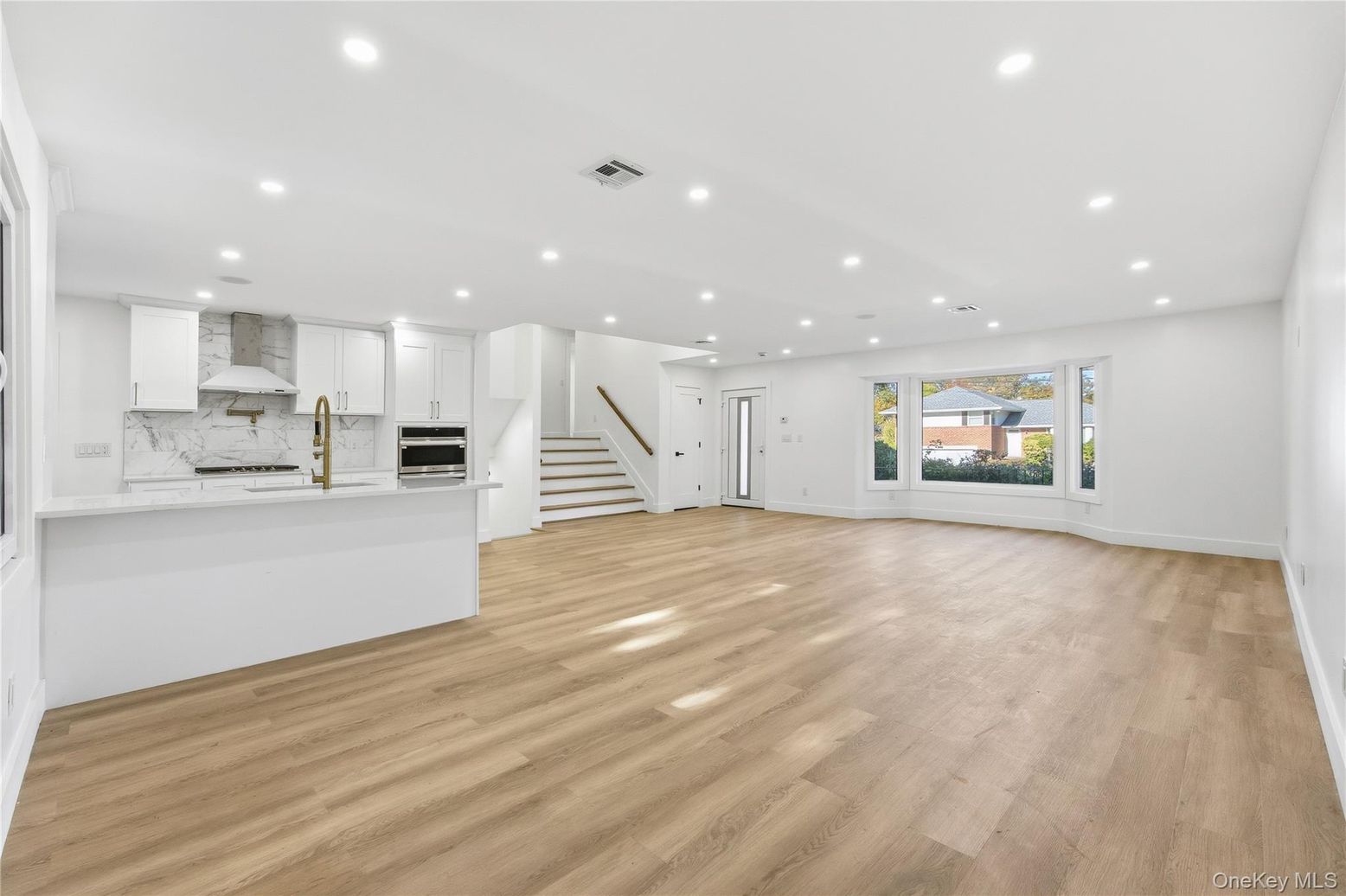 Interior, Kitchen, Marble Walls, Recessed Lighting, Stainless Steel Appliances, Wood Texture Flooring