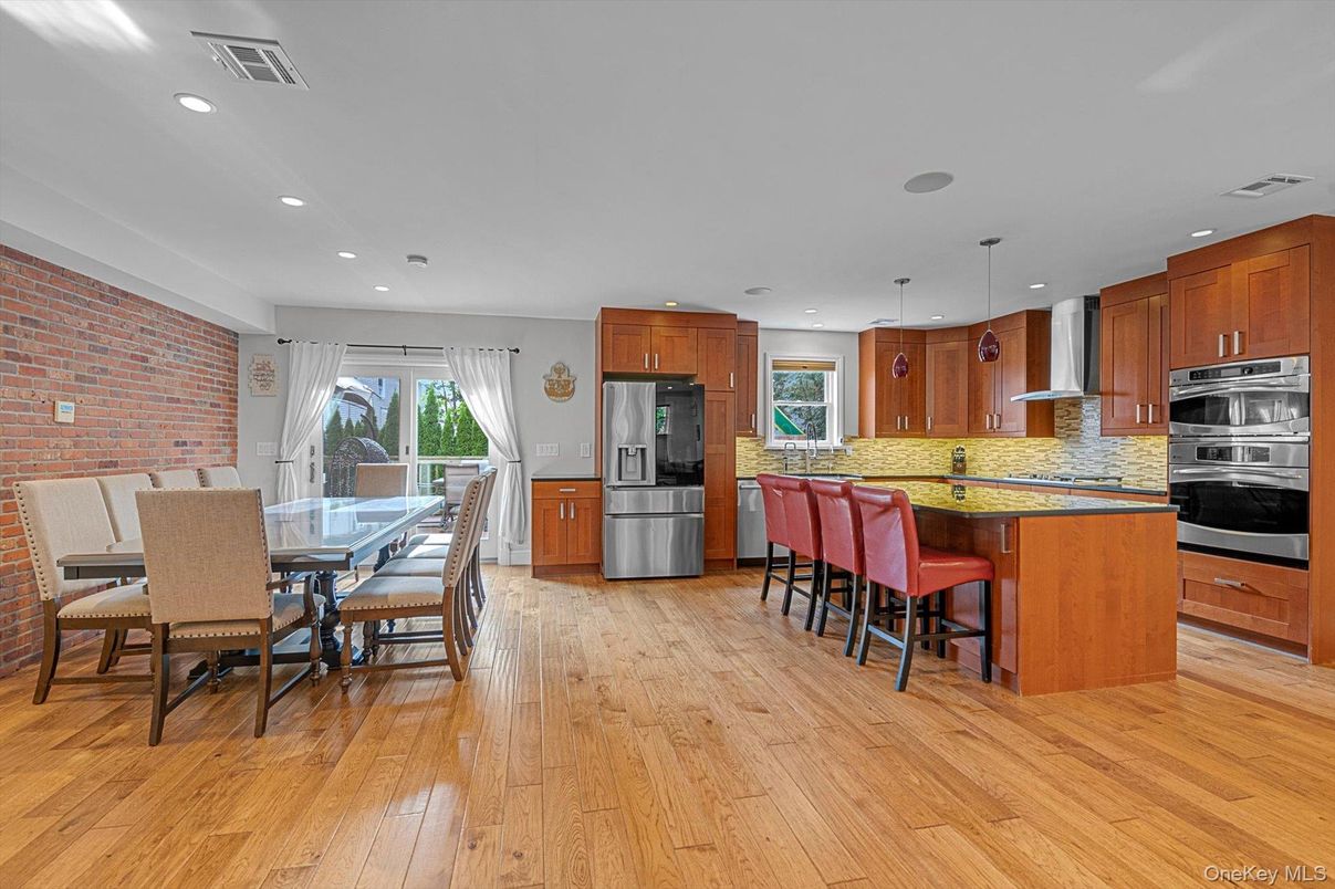 Dining room, Interior, Kitchen, Pendant Lights, Recessed Lighting, Stainless Steel Appliances, Stone Walls, Wood Texture Flooring
