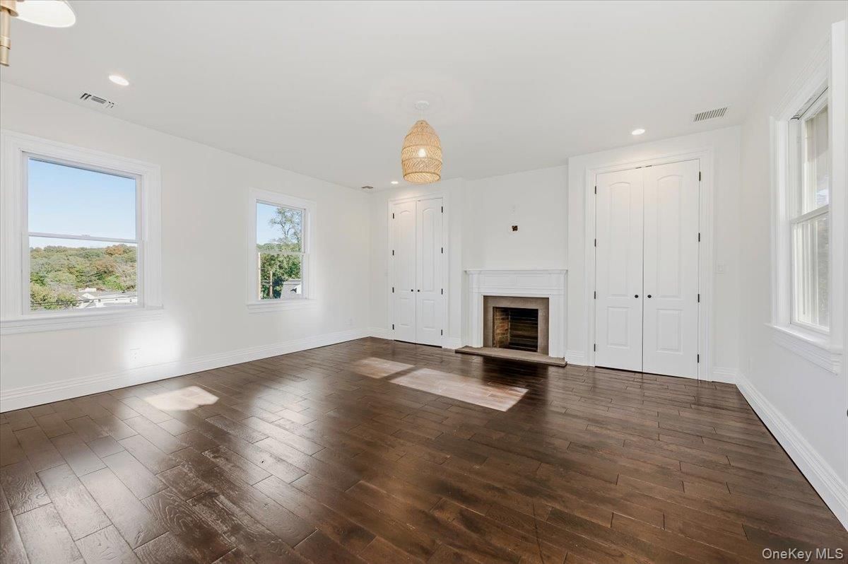 Chandelier, Empty room, Fireplace, Interior, Recessed Lighting, Wood Texture Flooring