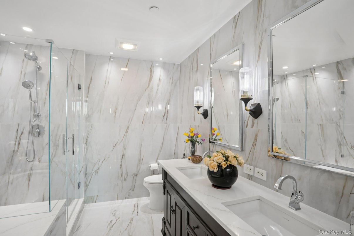 Bathroom, Dual Sink Vanities, Glass Shower, Interior, Marble, Marble Walls, Recessed Lighting