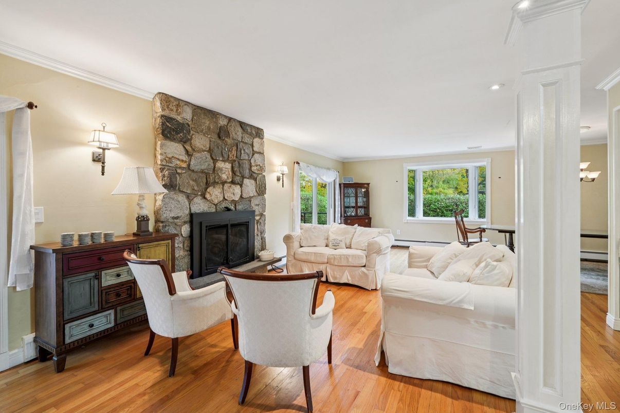 Fireplace, Interior, Living room, Recessed Lighting, Stone Walls, Wood Texture Flooring