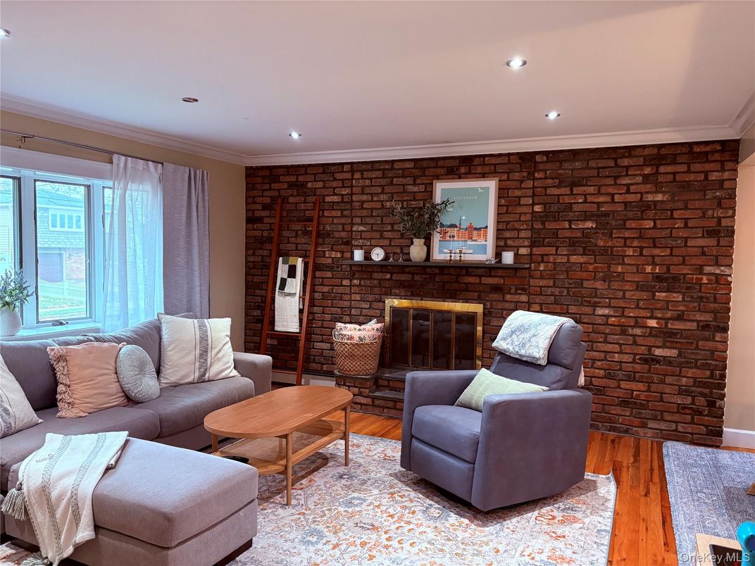 Fireplace, Interior, Living room, Recessed Lighting, Stone Walls, Wood Texture Flooring