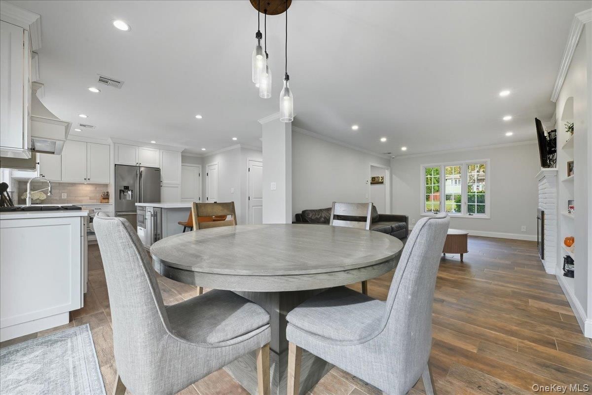 Dining room, Interior, Kitchen, Pendant Lights, Recessed Lighting, Stainless Steel Appliances, Wood Texture Flooring