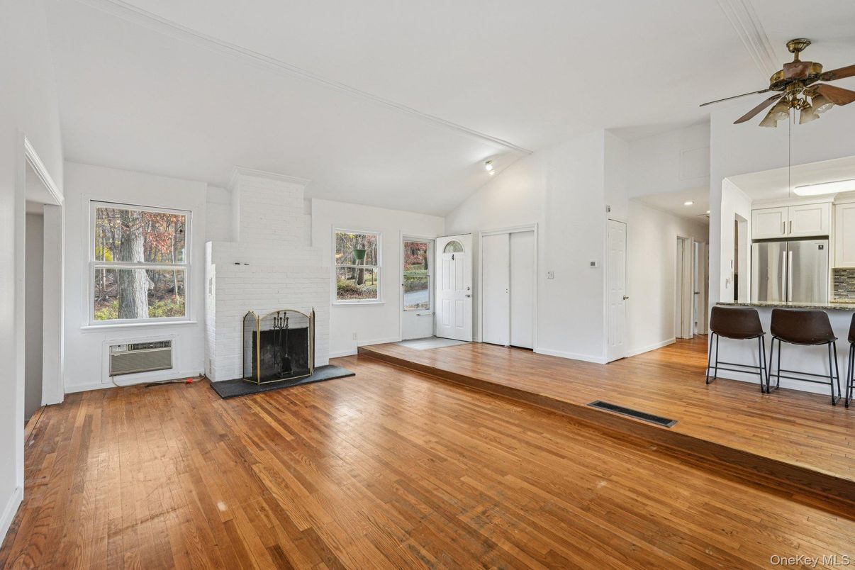 Empty room, Fireplace, Interior, Kitchen, Recessed Lighting, Wood Texture Flooring