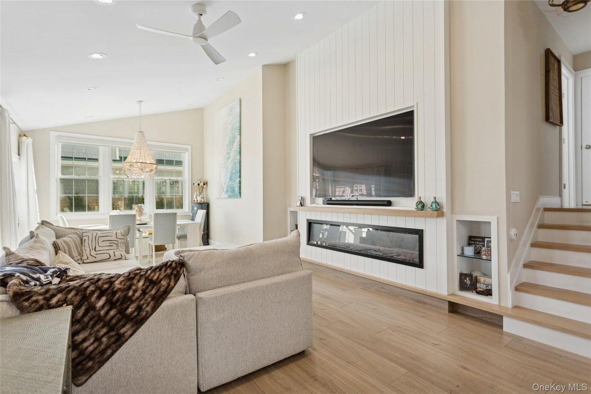 Chandelier, Dining room, Fireplace, Interior, Living room, Pendant Lights, Recessed Lighting, Wood Texture Flooring