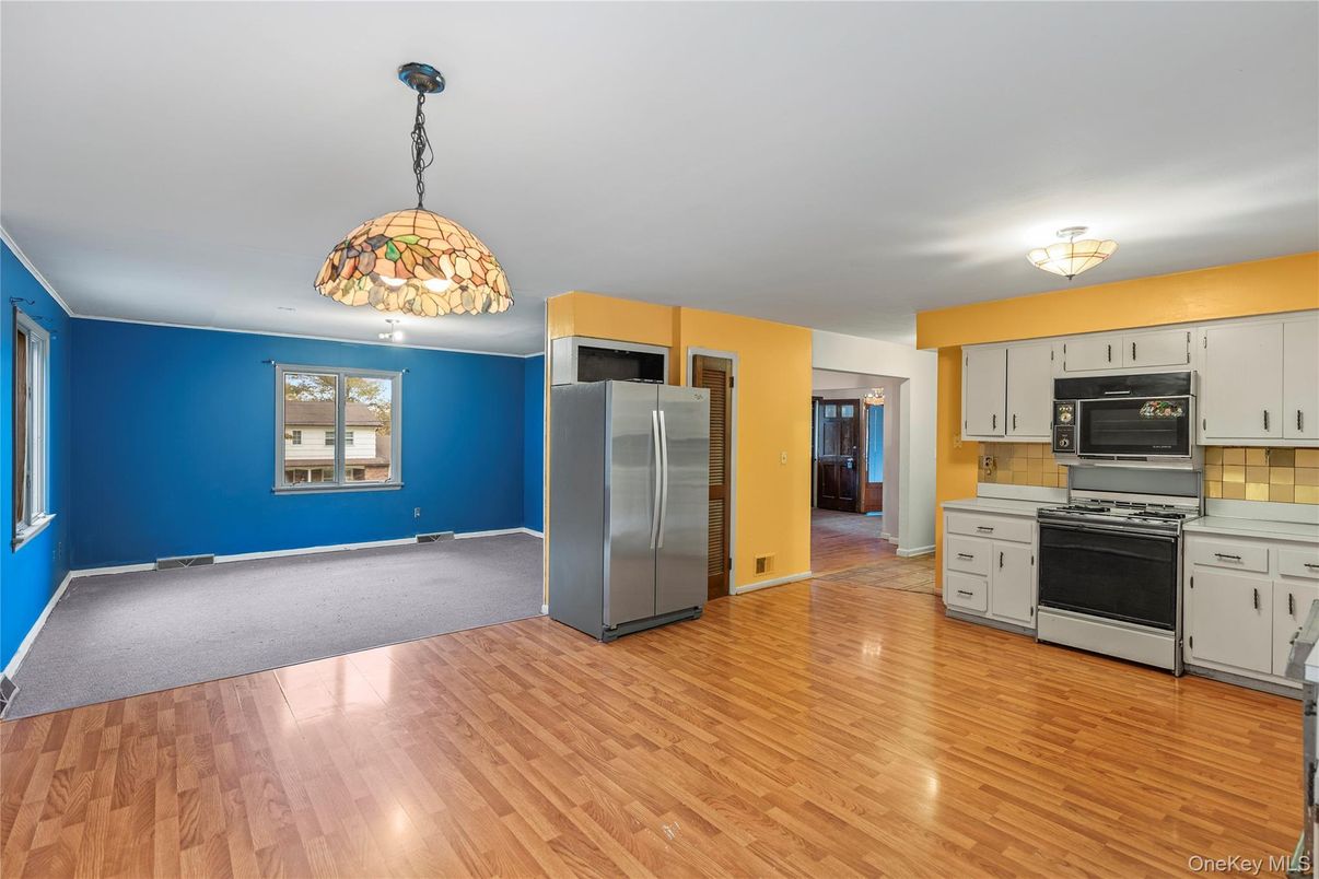 Empty room, Interior, Kitchen, Pendant Lights, Stainless Steel Appliances, Wood Texture Flooring