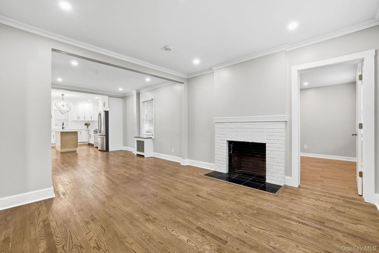 Empty room, Fireplace, Interior, Kitchen, Recessed Lighting, Wood Texture Flooring