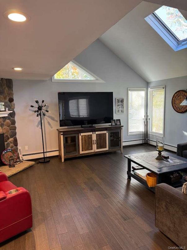 Fireplace, Interior, Living room, Recessed Lighting, Stone Walls, Wood Texture Flooring