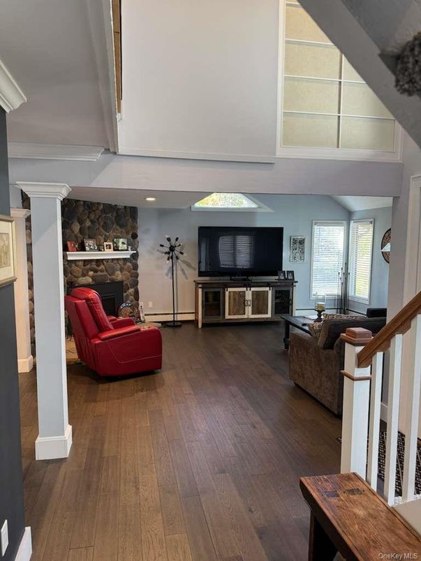 Fireplace, Interior, Living room, Recessed Lighting, Stone Walls, Wood Texture Flooring