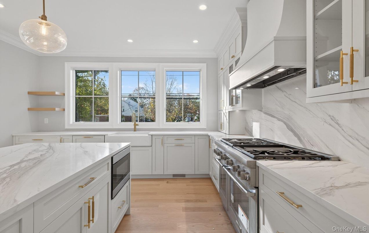 Interior, Kitchen, Marble Walls, Pendant Lights, Recessed Lighting, Stainless Steel Appliances, Wood Texture Flooring