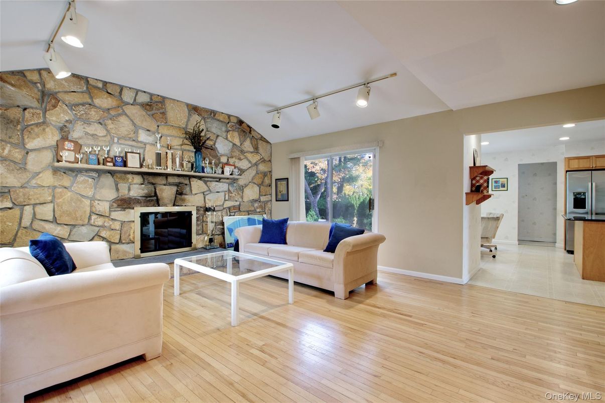 Fireplace, Interior, Kitchen, Living room, Recessed Lighting, Stone Walls, Wood Texture Flooring