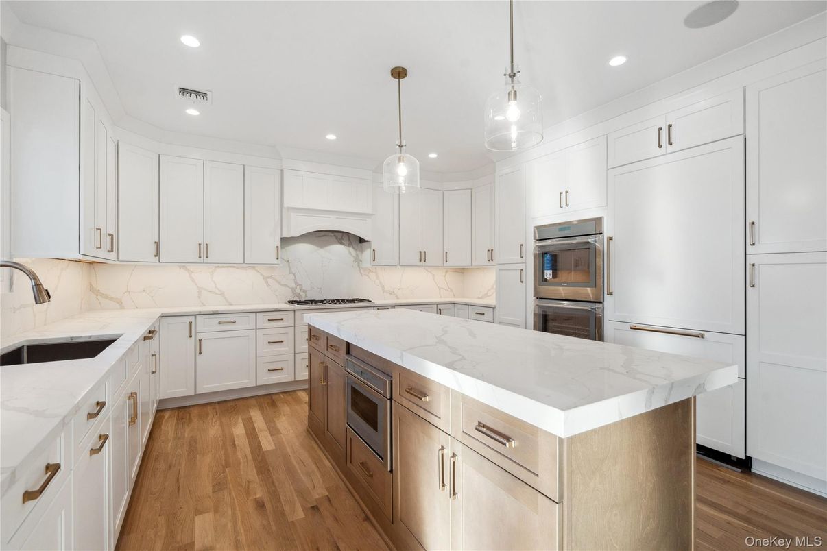 Interior, Kitchen, Marble Walls, Pendant Lights, Recessed Lighting, Stainless Steel Appliances, Wood Texture Flooring