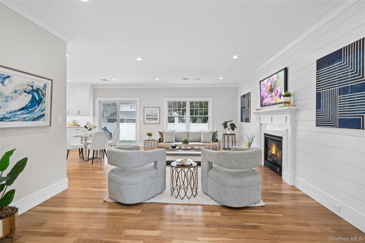 Dining room, Fireplace, Interior, Living room, Recessed Lighting, Wood Texture Flooring